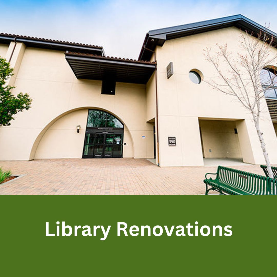 Exterior view of the Gilroy Library building entrance with arched doorway and courtyard seating area